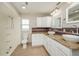Updated bathroom with double vanity and granite countertop at 23104 Newcun Ave, Punta Gorda, FL 33980