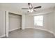Bedroom with walk-in closet and ceiling fan at 23104 Newcun Ave, Punta Gorda, FL 33980
