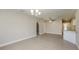 Dining room features hardwood floors and a chandelier at 23104 Newcun Ave, Punta Gorda, FL 33980