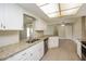 Kitchen with granite countertops and stainless steel appliances at 23104 Newcun Ave, Punta Gorda, FL 33980