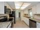 Updated kitchen with granite countertops and stainless steel appliances at 23104 Newcun Ave, Punta Gorda, FL 33980