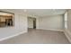 Bright living room with laminate flooring and access to kitchen at 23104 Newcun Ave, Punta Gorda, FL 33980