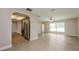 Open concept living and kitchen area with stainless steel appliances at 23104 Newcun Ave, Punta Gorda, FL 33980