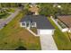 New construction home with gray exterior and paved driveway at 3505 Brownwood Ter, North Port, FL 34286