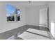 Bright bedroom with large window and grey tile floor at 3505 Brownwood Ter, North Port, FL 34286