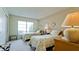Well-lit bedroom with twin beds and large window at 6809 9Th W Ave # 0, Bradenton, FL 34209