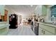Efficient kitchen with light wood cabinets and appliances at 6809 9Th W Ave # 0, Bradenton, FL 34209