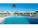 Community pool with surrounding patio furniture at 6809 9Th W Ave # 0, Bradenton, FL 34209