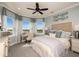 Relaxing bedroom with a calm color palette, and views of the backyard at 7044 Foxboro Way, Nokomis, FL 34275