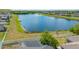 Aerial view of house with lake view in the background at 14308 Edinburgh Moor Dr, Wimauma, FL 33598