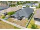 Aerial view of house with backyard and white fence at 14308 Edinburgh Moor Dr, Wimauma, FL 33598