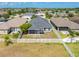 Aerial view of house with backyard and white fence at 14308 Edinburgh Moor Dr, Wimauma, FL 33598