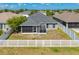 Aerial view of house with backyard and white fence at 14308 Edinburgh Moor Dr, Wimauma, FL 33598