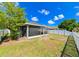 Screened patio and fenced backyard with spacious grassy area at 14308 Edinburgh Moor Dr, Wimauma, FL 33598