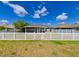 Home with a fenced backyard and gated access at 14308 Edinburgh Moor Dr, Wimauma, FL 33598