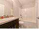 Small bathroom with tub, single vanity, and toilet at 14308 Edinburgh Moor Dr, Wimauma, FL 33598