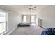 Second bedroom with ceiling fan and neutral decor at 14308 Edinburgh Moor Dr, Wimauma, FL 33598