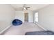 Spacious bedroom with a beanbag chair and window at 14308 Edinburgh Moor Dr, Wimauma, FL 33598