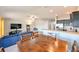 Open dining area with wooden table and view into kitchen at 14308 Edinburgh Moor Dr, Wimauma, FL 33598