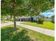 Home exterior with front yard and sidewalk at 14308 Edinburgh Moor Dr, Wimauma, FL 33598