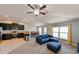 Open concept kitchen and living room with a center island and a sectional sofa at 14308 Edinburgh Moor Dr, Wimauma, FL 33598