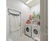 Laundry room with washer, dryer and ample storage at 14308 Edinburgh Moor Dr, Wimauma, FL 33598