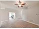 Bright living room with carpeting and office view at 14308 Edinburgh Moor Dr, Wimauma, FL 33598