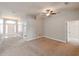 Spacious living room with carpeting and ceiling fan at 14308 Edinburgh Moor Dr, Wimauma, FL 33598
