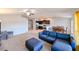 Living room with sectional sofa and view into kitchen and dining area at 14308 Edinburgh Moor Dr, Wimauma, FL 33598