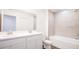 Bathroom with double vanity and bathtub at 32094 Eastern Redbud Br, San Antonio, FL 33576