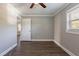 Inviting bedroom with wood-look floors, a ceiling fan, and neutral paint at 2558 12Th S Ave, St Petersburg, FL 33712