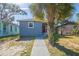 Charming blue home with a welcoming front path and mature palm tree at 2558 12Th S Ave, St Petersburg, FL 33712