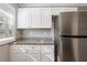 Well-appointed kitchen with white cabinets, granite counters, and stainless steel appliances at 2558 12Th S Ave, St Petersburg, FL 33712