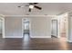 Open-concept living room with wood-look floors and access to other rooms at 2558 12Th S Ave, St Petersburg, FL 33712