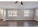 Spacious living area with large windows, wood-look floors, and neutral gray walls at 2558 12Th S Ave, St Petersburg, FL 33712