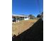 Large backyard with grass and a wooden fence at 5770 46Th N Ave, Kenneth City, FL 33709