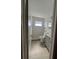 Modern bathroom with white tile shower, gray vanity, and updated fixtures at 5770 46Th N Ave, Kenneth City, FL 33709