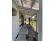 Covered walkway leads to a screened-in back porch at 5770 46Th N Ave, Kenneth City, FL 33709