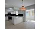 Remodeled kitchen with white cabinets, quartz countertops, and stainless steel appliances at 5770 46Th N Ave, Kenneth City, FL 33709
