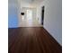Spacious living room with adjacent dining space and view into the kitchen at 5770 46Th N Ave, Kenneth City, FL 33709