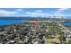 Aerial view of a residential neighborhood near water, with trees, houses, and a city view at 753 37Th S Ave, St Petersburg, FL 33705