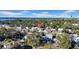Aerial view of a residential neighborhood with trees, houses, and a city skyline in the background at 753 37Th S Ave, St Petersburg, FL 33705