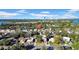 Aerial view of a neighborhood with houses, trees, and a city skyline in the background at 753 37Th S Ave, St Petersburg, FL 33705