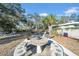 Backyard patio with a unique table and seating area, ideal for outdoor dining at 753 37Th S Ave, St Petersburg, FL 33705