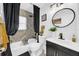 Stylish bathroom with marble tile, modern fixtures, and a soaking tub at 753 37Th S Ave, St Petersburg, FL 33705