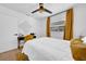 Secondary bedroom featuring a comfortable bed, desk area, and modern light fixture at 753 37Th S Ave, St Petersburg, FL 33705