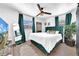 Inviting main bedroom with a plush bed, stylish decor, and wood-look floors at 753 37Th S Ave, St Petersburg, FL 33705
