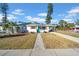 Charming single-story home with a teal front door and a well-maintained yard at 753 37Th S Ave, St Petersburg, FL 33705