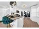 Modern kitchen with white cabinets, stainless steel appliances, and a breakfast bar at 753 37Th S Ave, St Petersburg, FL 33705