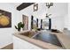 Kitchen island with stainless steel sink, sleek countertops, and modern pendant lighting at 753 37Th S Ave, St Petersburg, FL 33705